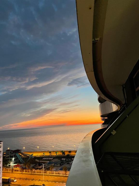 a view of the ocean from the window of an airplane at Orbi Residence Sea View in Batumi