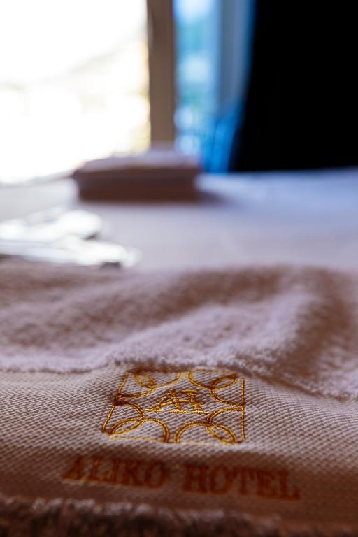 Postel nebo postele na pokoji v ubytování Aliko Hotel