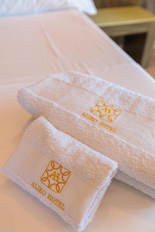 Postel nebo postele na pokoji v ubytování Aliko Hotel
