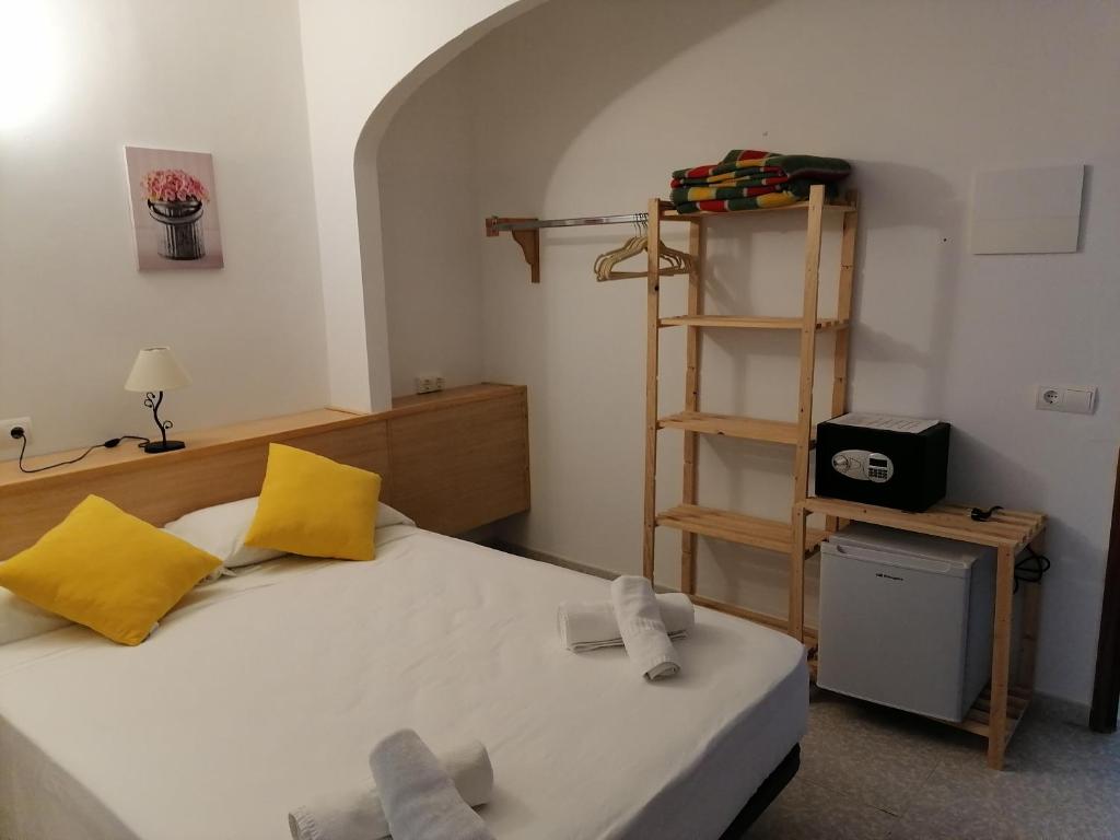 Postel nebo postele na pokoji v ubytování Hostal Pepe