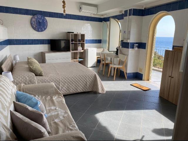 Posteľ alebo postele v izbe v ubytovaní SUITE ISOLA BELLA