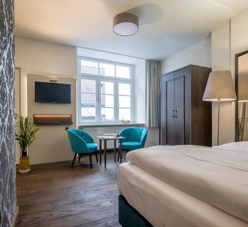 Postel nebo postele na pokoji v ubytování Altstadthotel der Patrizier