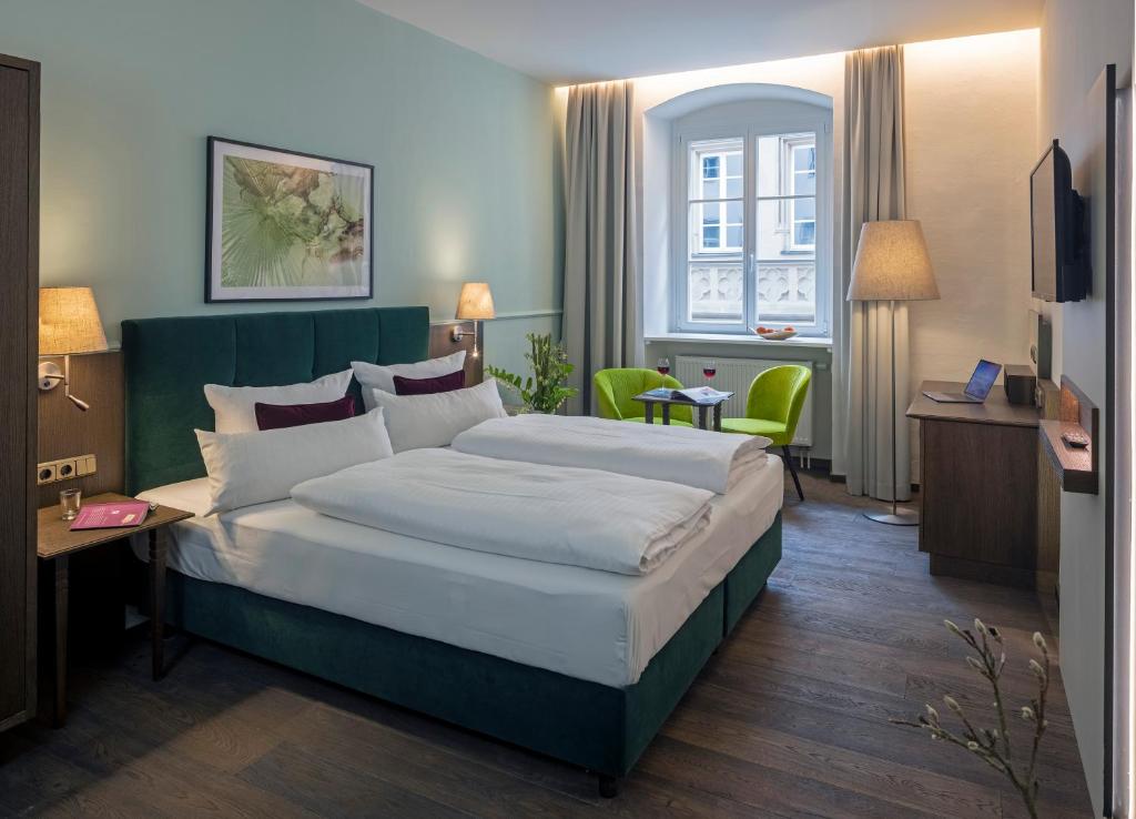 Postel nebo postele na pokoji v ubytování Altstadthotel der Patrizier