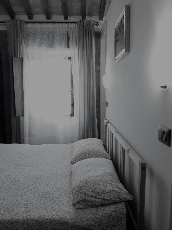 Łóżko lub łóżka w pokoju w obiekcie Casa Tosca
