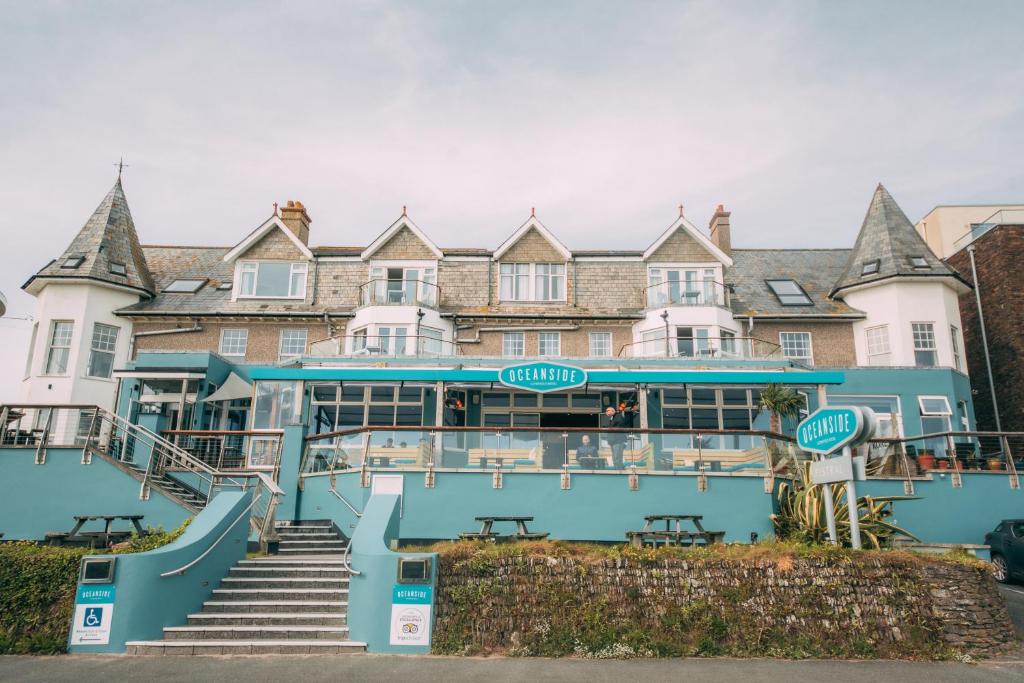 a large building with stairs in front of it at Oceanside Lifestyle Hotel in Newquay