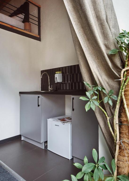 Kuchyň nebo kuchyňský kout v ubytování Mezzanine Hotel