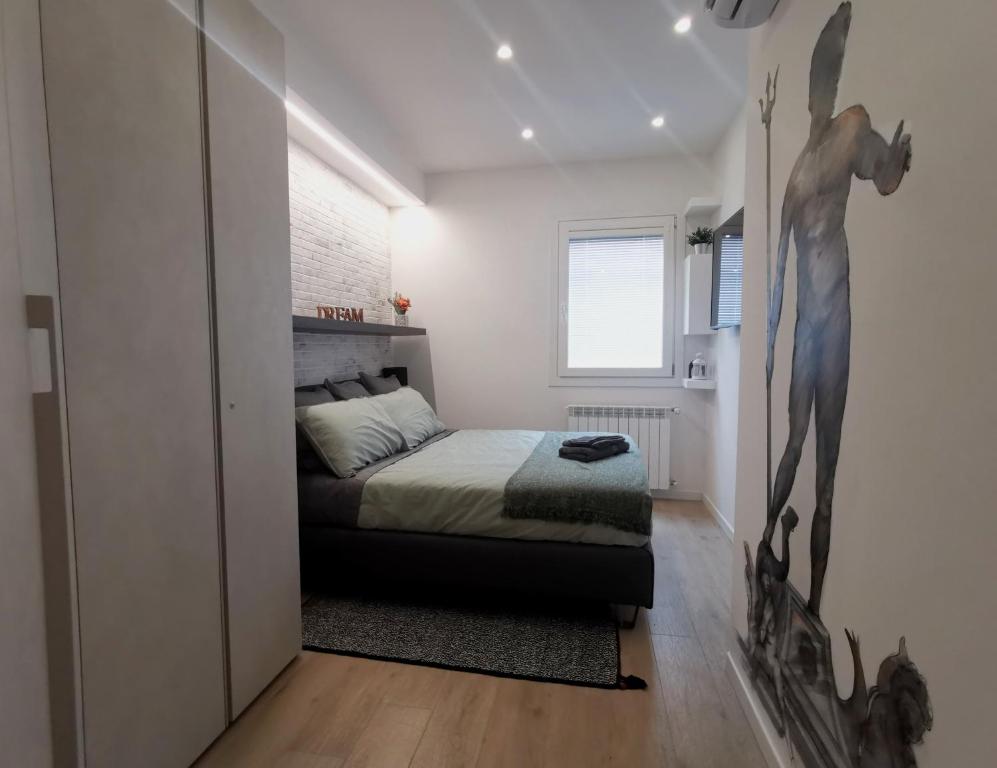 Ένα ή περισσότερα κρεβάτια σε δωμάτιο στο 051 Guest House Sant'Orsola Malpighi