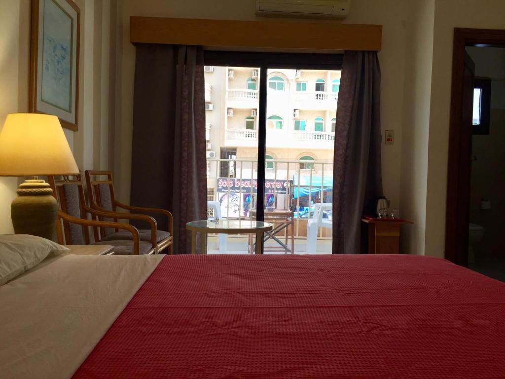 Postel nebo postele na pokoji v ubytování Masaya Hurghada