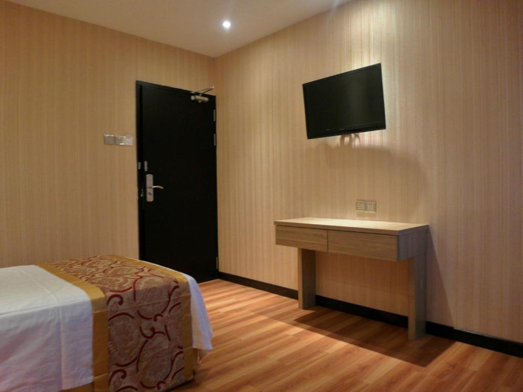 TV a/nebo společenská místnost v ubytování Mandarin Hotel Kota Kinabalu