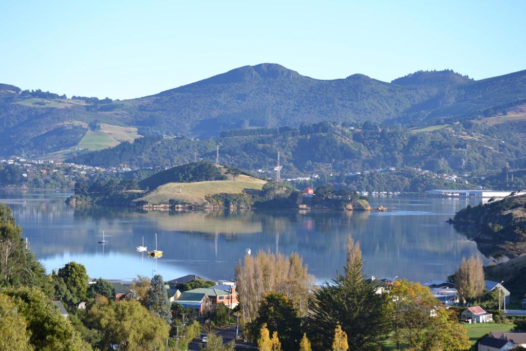 a view of a lake with mountains in the background at Treetops B&B in Portobello