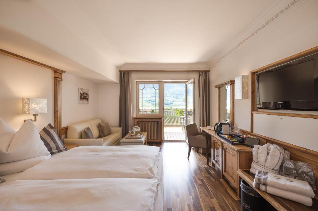 Postel nebo postele na pokoji v ubytování Weinegg Wellviva Resort