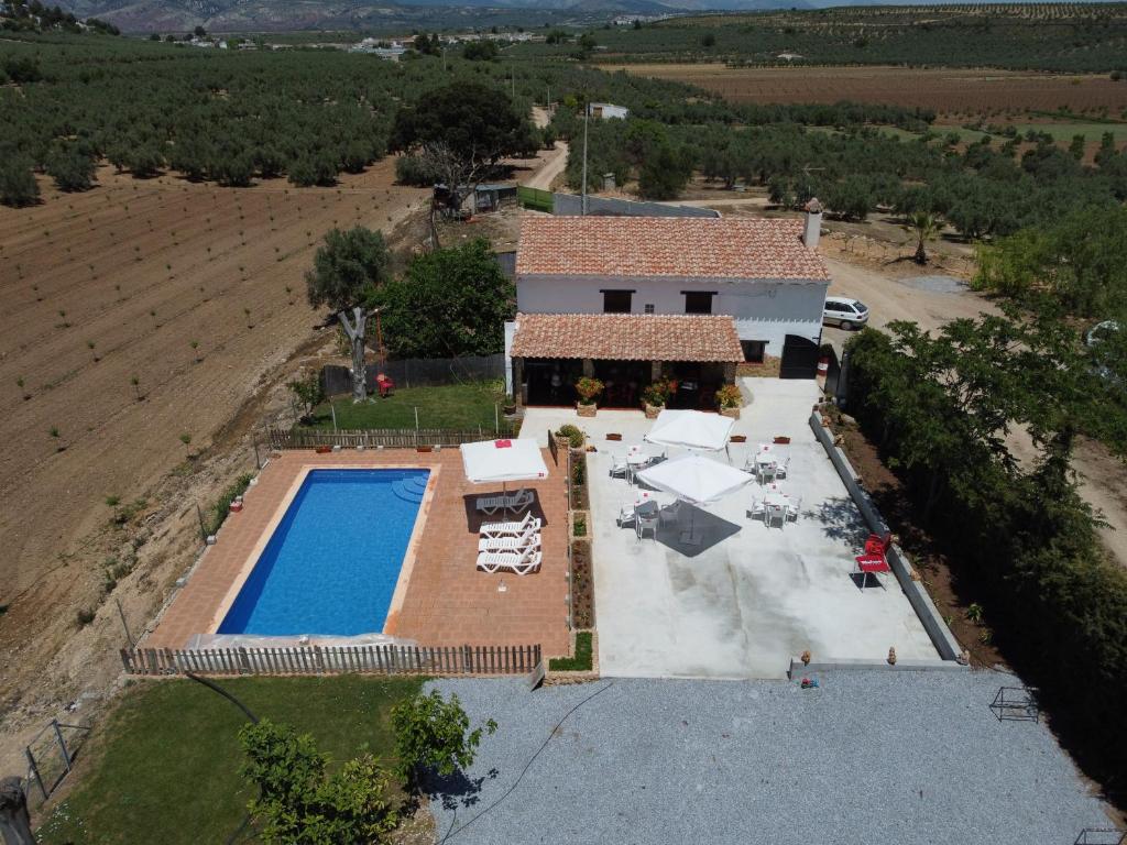 an aerial view of a house with a swimming pool at Cortijo Rural La Chula in Fontanar
