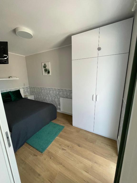 Łóżko lub łóżka w pokoju w obiekcie Gąski Apartament Nadmorski