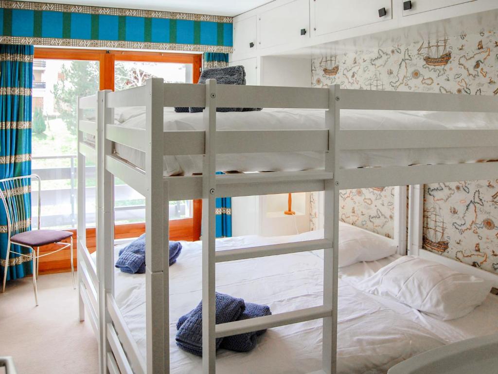 Postel nebo postele na pokoji v ubytování Apartment Panoramic G4 by Interhome
