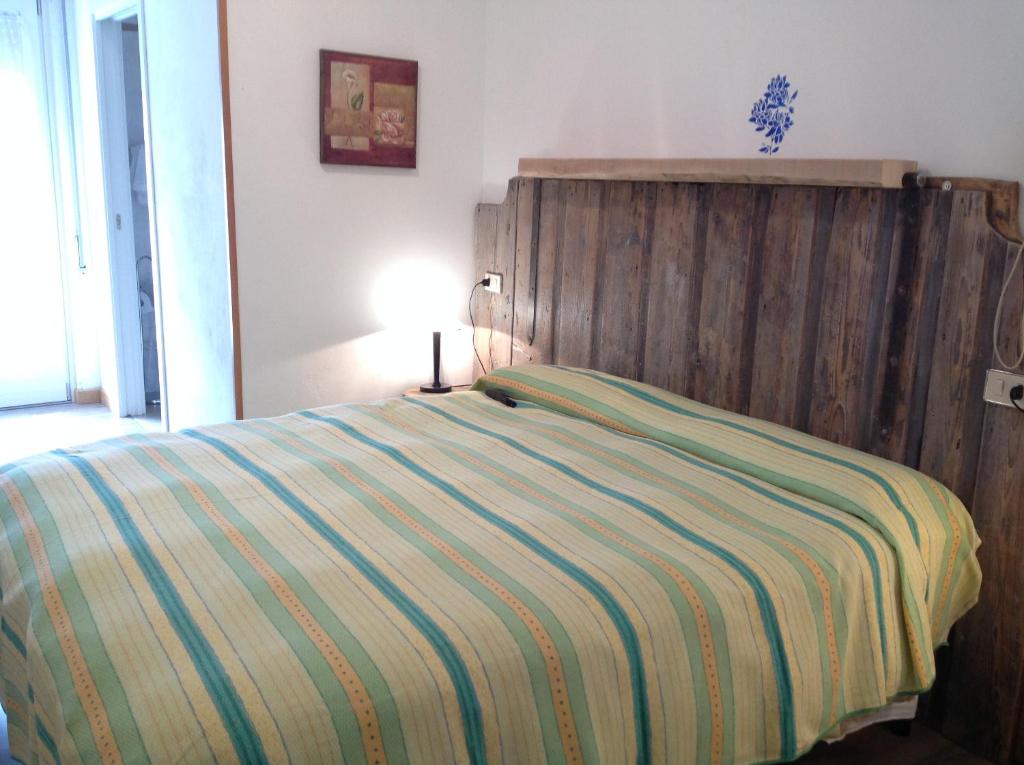 A bed or beds in a room at Albergo Vittoria