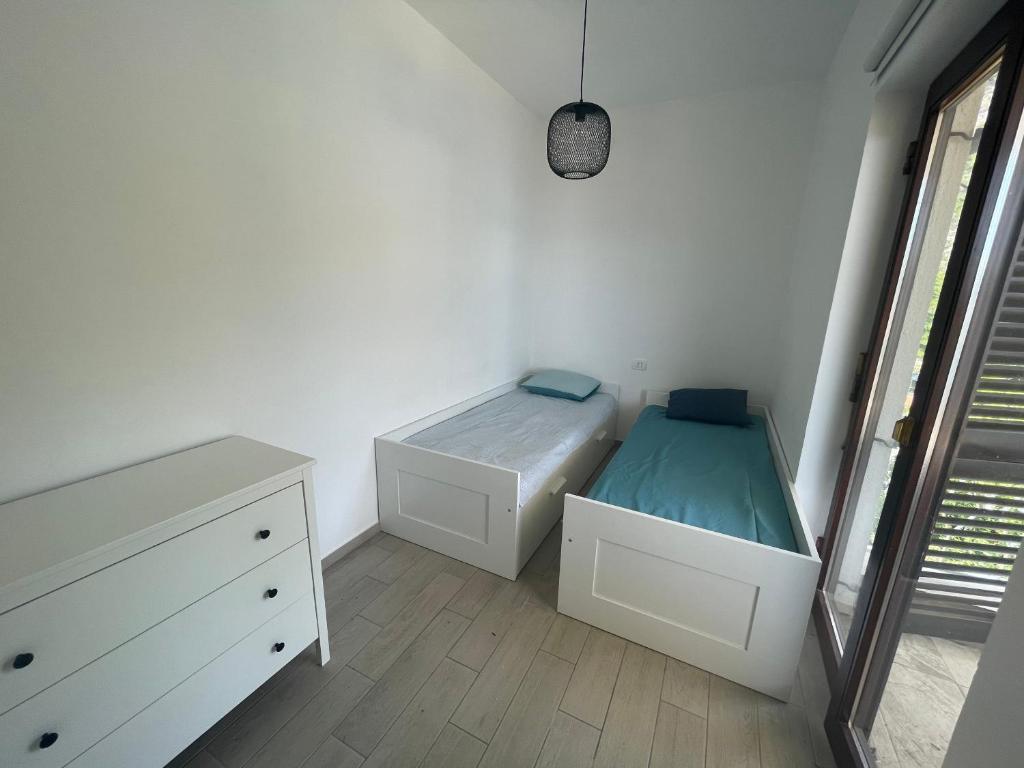 Postel nebo postele na pokoji v ubytování Apartmani Pulić