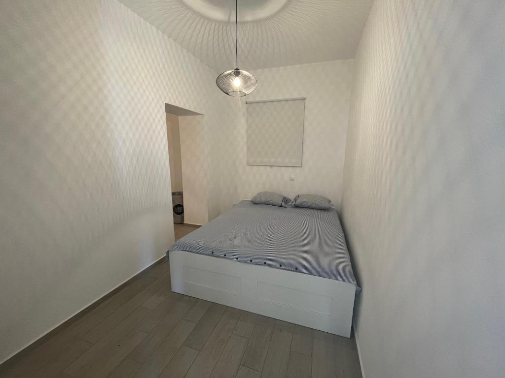 Postel nebo postele na pokoji v ubytování Apartmani Pulić