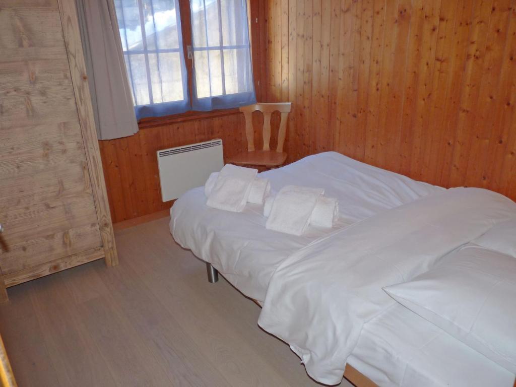 Postel nebo postele na pokoji v ubytování Apartment Frênes by Interhome