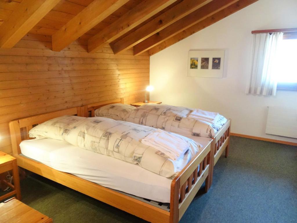 Postel nebo postele na pokoji v ubytování Apartment Aragon T100 by Interhome