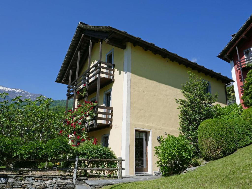 a building with balconies on the side of it at Apartment Nelly by Interhome in Ponto Valentino