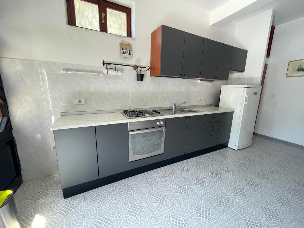 Kuchyň nebo kuchyňský kout v ubytování Apartmani Pulić