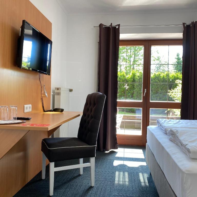 TV a/nebo společenská místnost v ubytování Alpenhotel Gastager