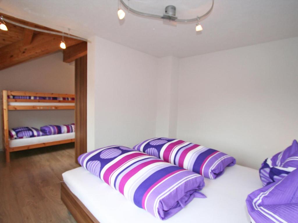 A bed or beds in a room at Holiday Home Heidi by Interhome