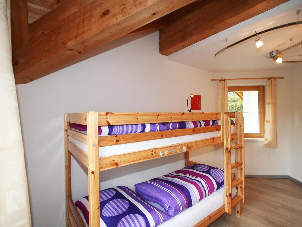 A bed or beds in a room at Holiday Home Heidi by Interhome