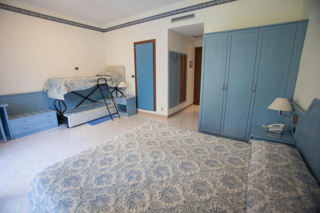 Postel nebo postele na pokoji v ubytování Hotel Ariston