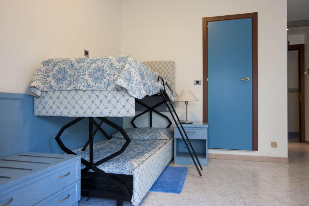 Postel nebo postele na pokoji v ubytování Hotel Ariston