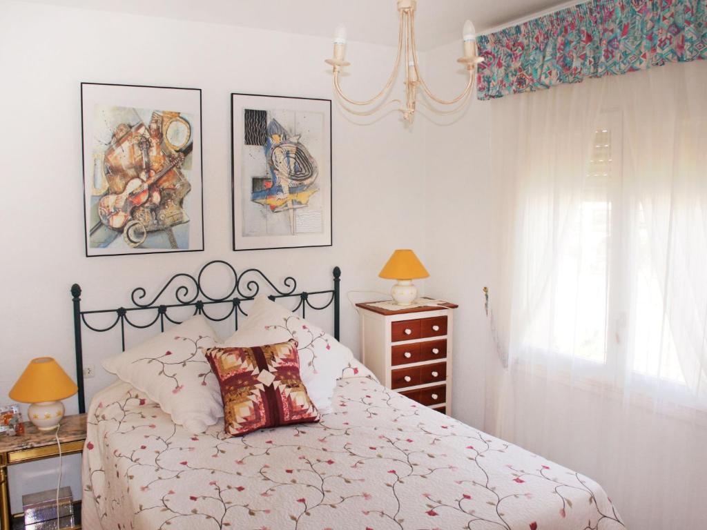 A bed or beds in a room at Holiday Home Papagayo by Interhome