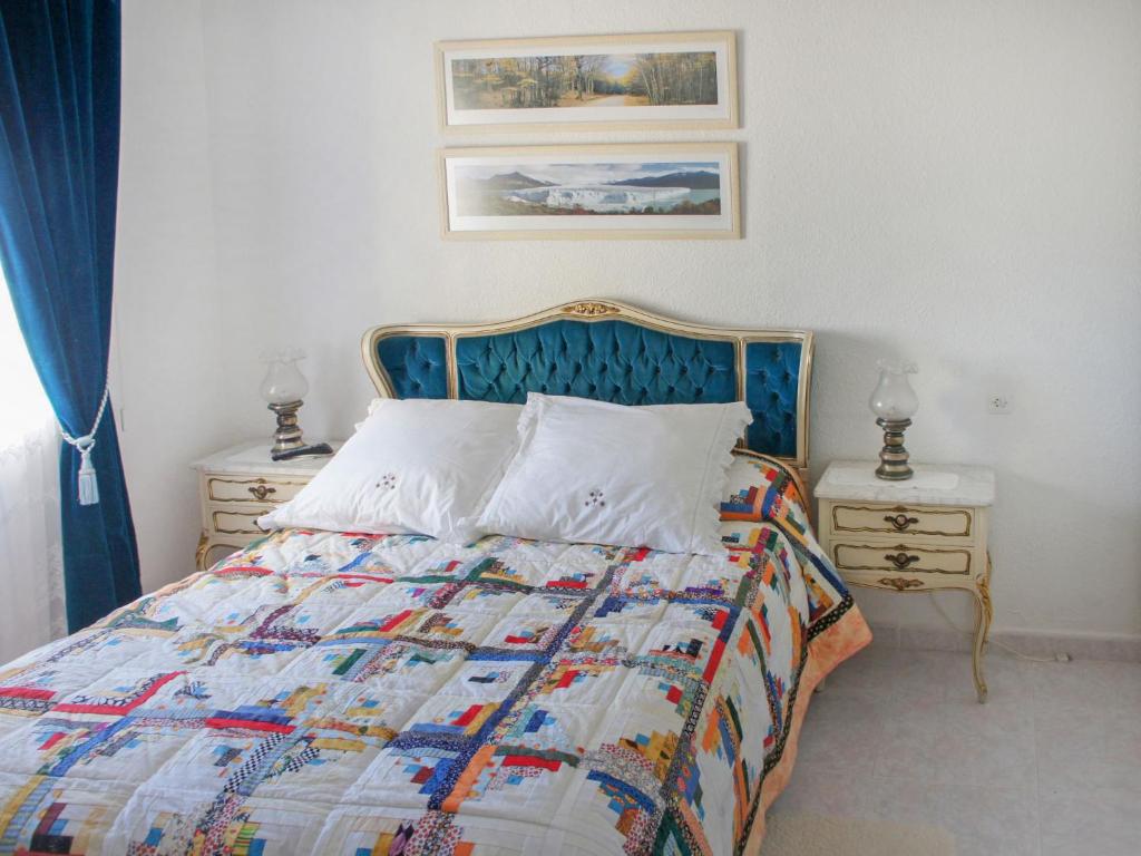 A bed or beds in a room at Holiday Home Papagayo by Interhome