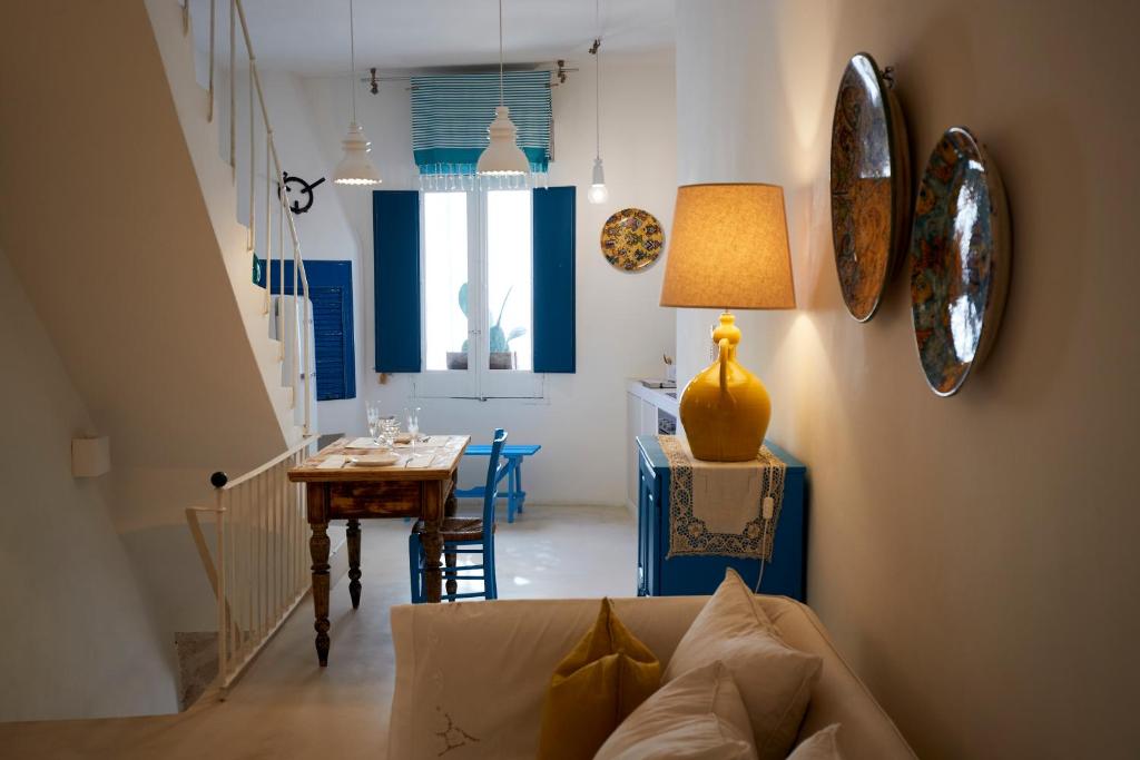 a living room with a couch and a table at Dei Serafini in Polignano a Mare