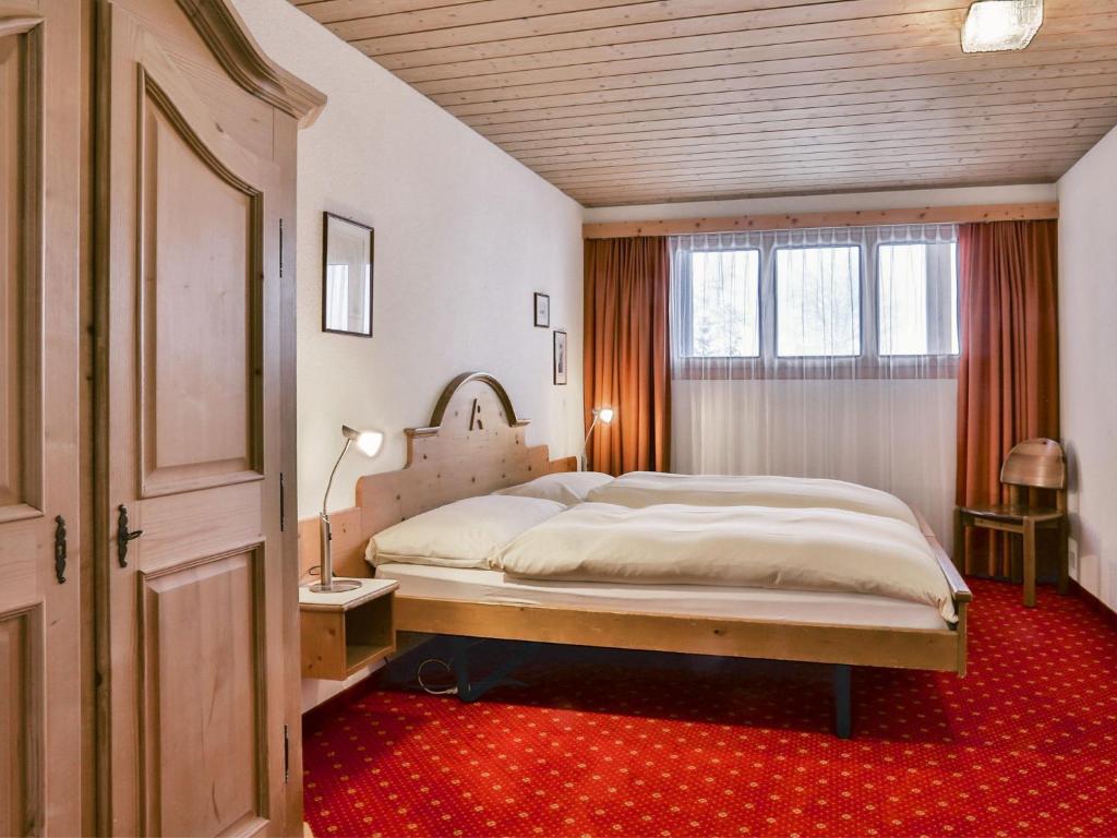 Кровать или кровати в номере Apartment Chalet Abendrot apARTments-23 by Interhome