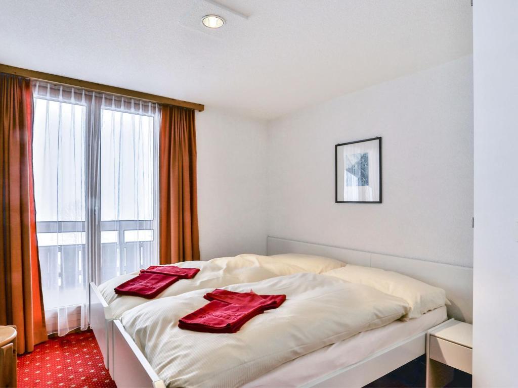 Кровать или кровати в номере Apartment Chalet Abendrot apARTments-23 by Interhome