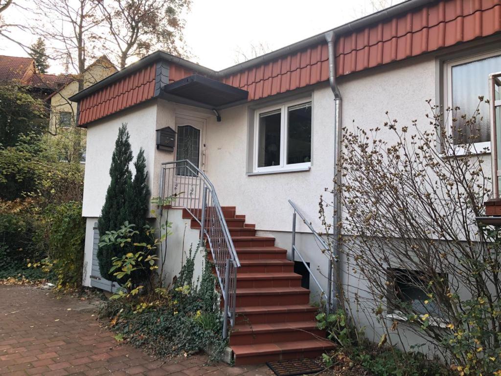 a house with a staircase leading to a door at Ferienwohnung Black Beauty in Wernigerode