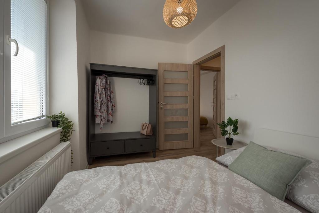 Postel nebo postele na pokoji v ubytování Symple apartments