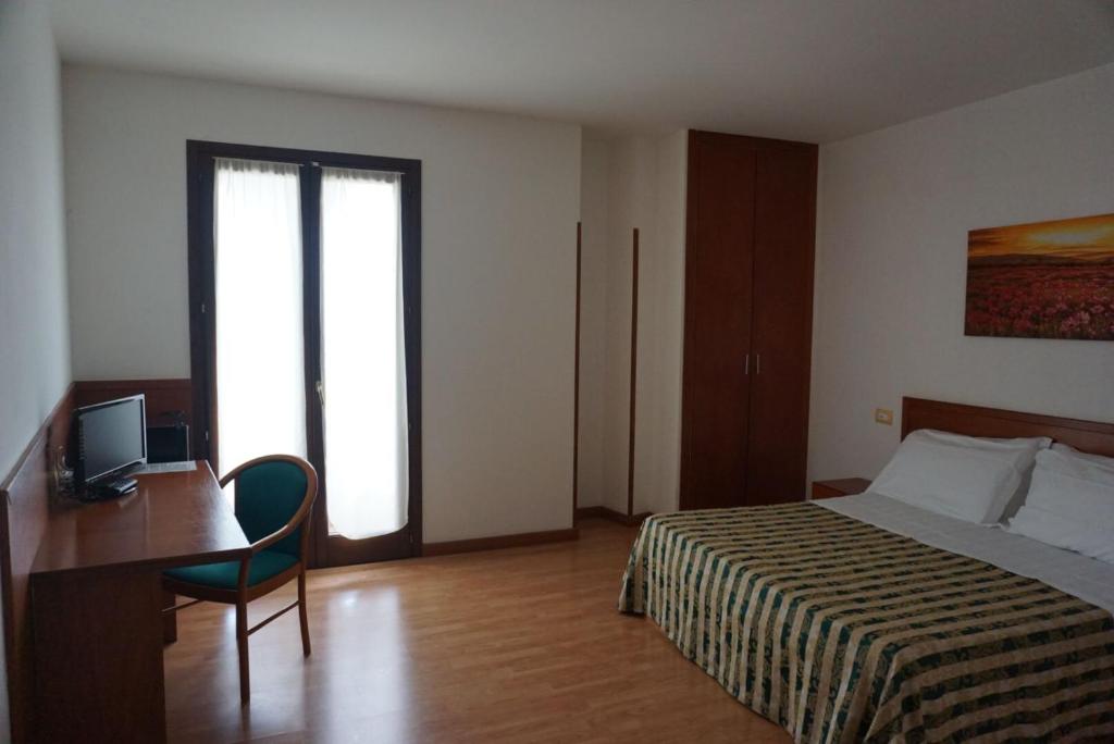 Postel nebo postele na pokoji v ubytování Hotel Nicolaj