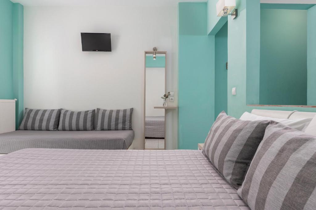 Postel nebo postele na pokoji v ubytování Ouzas luxury Hotel