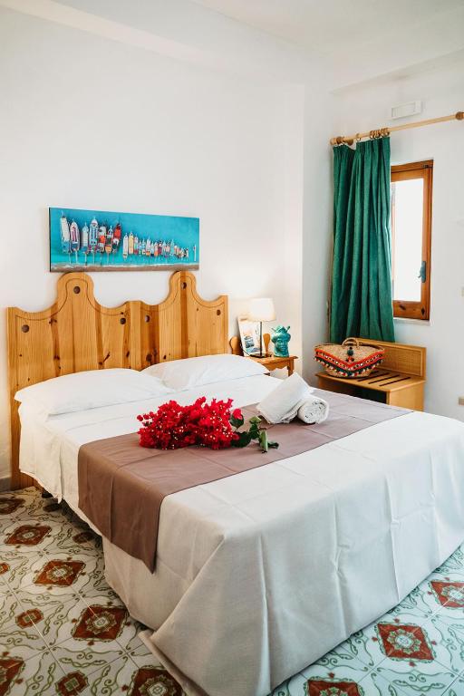 Postel nebo postele na pokoji v ubytování Hotel Rojas