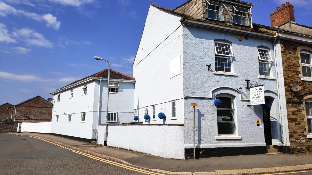 a white building on the side of a street at Elnor Guest House in Liskeard