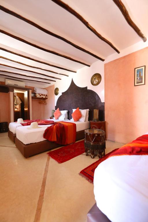 Postel nebo postele na pokoji v ubytování Riad Sidi Mimoune & Spa