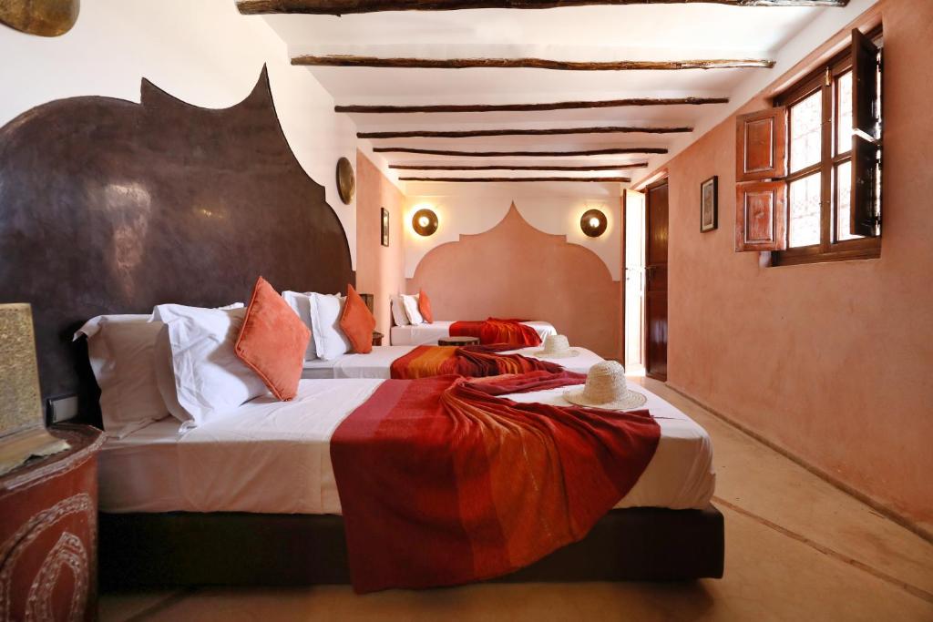 Postel nebo postele na pokoji v ubytování Riad Sidi Mimoune & Spa