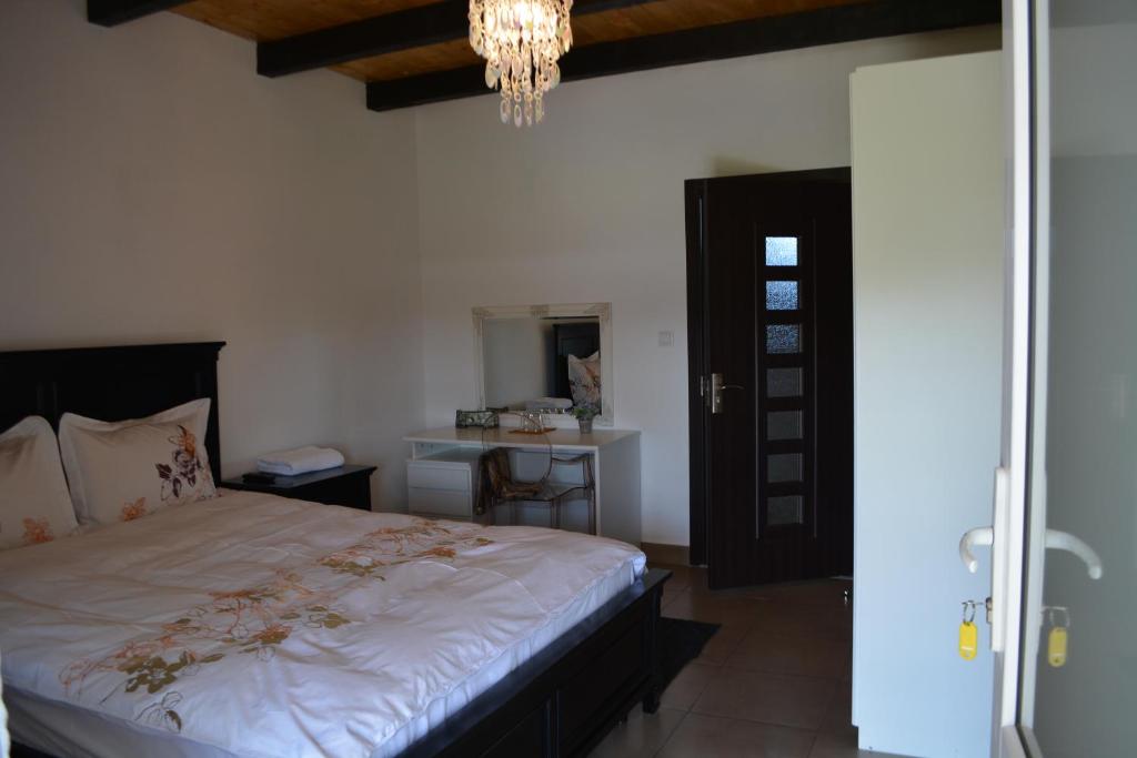 Posteľ alebo postele v izbe v ubytovaní Vila Ardelean