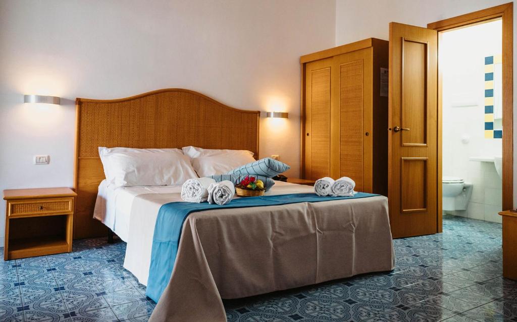 Postel nebo postele na pokoji v ubytování Hotel Rojas