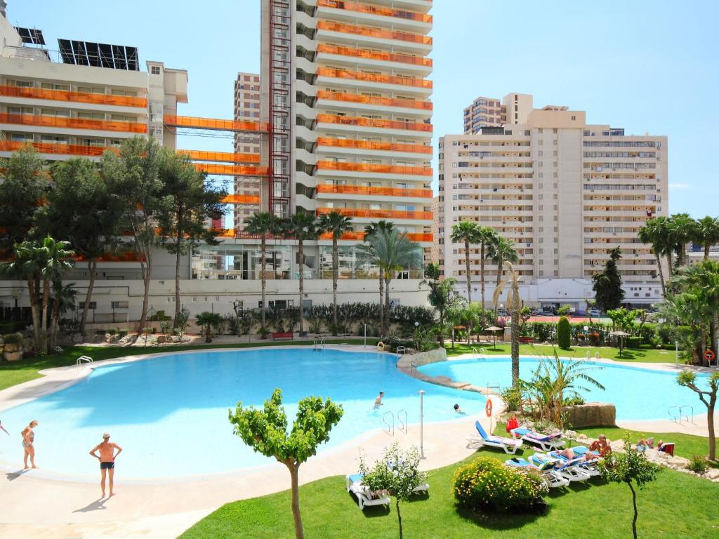 a large swimming pool in a city with tall buildings at Apartment Gemelos by Interhome in Benidorm