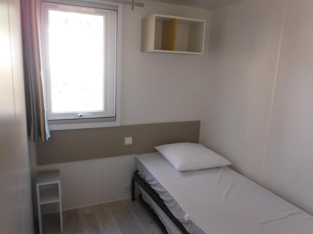 Postel nebo postele na pokoji v ubytování Camping l'Eléphant