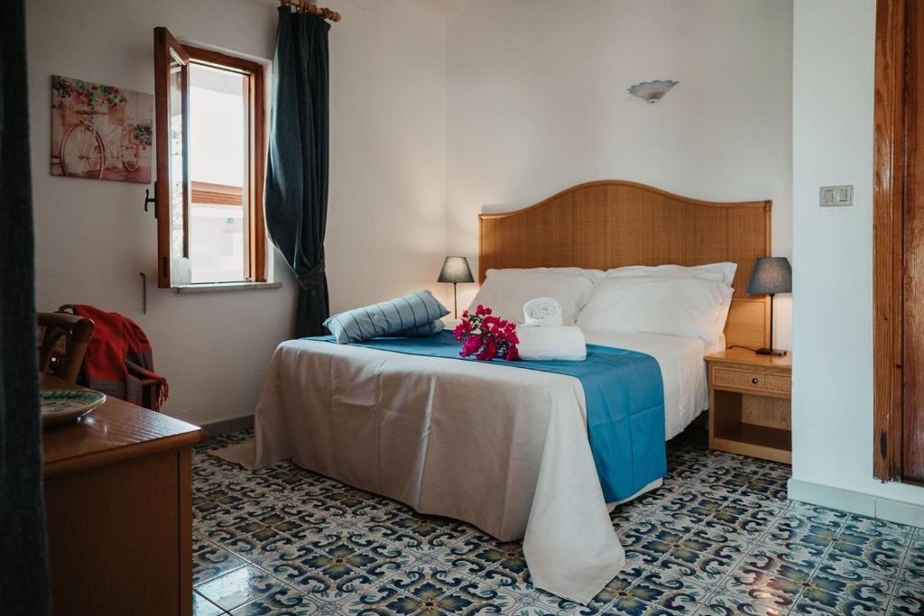 Postel nebo postele na pokoji v ubytování Hotel Rojas