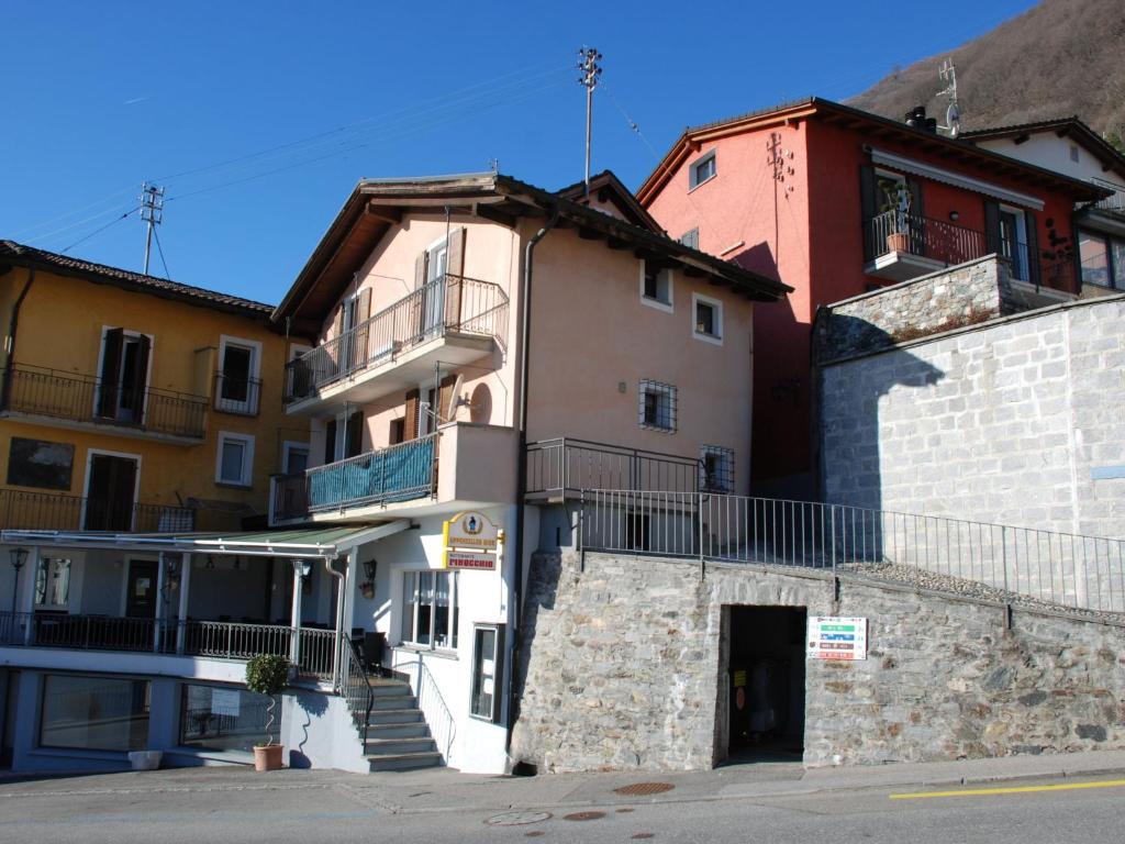 a building with a staircase in front of it at Apartment Busbai by Interhome in Ronco sopra Ascona