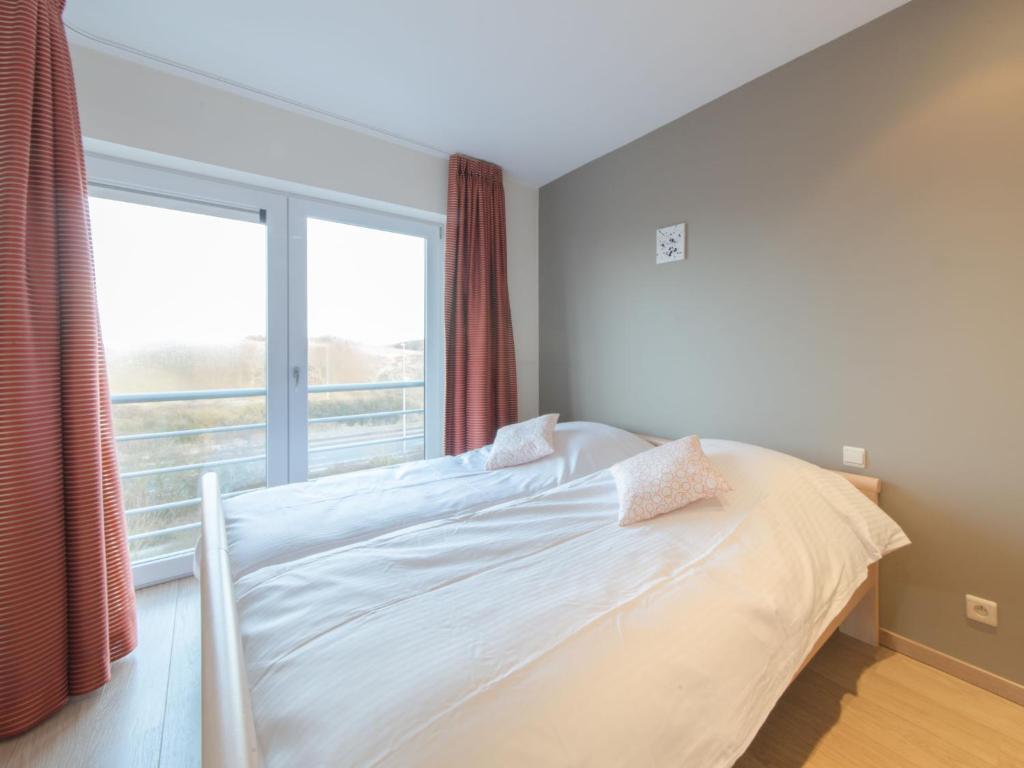 Postel nebo postele na pokoji v ubytování Apartment Seaside 4-02 by Interhome